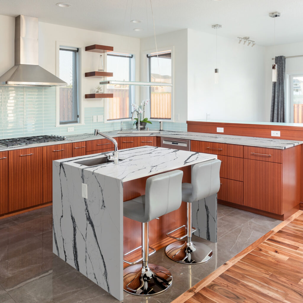 High-end kitchen with island, two sinks, and elegant floor
