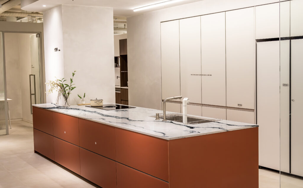 High-end kitchen with island, two sinks, and elegant floor